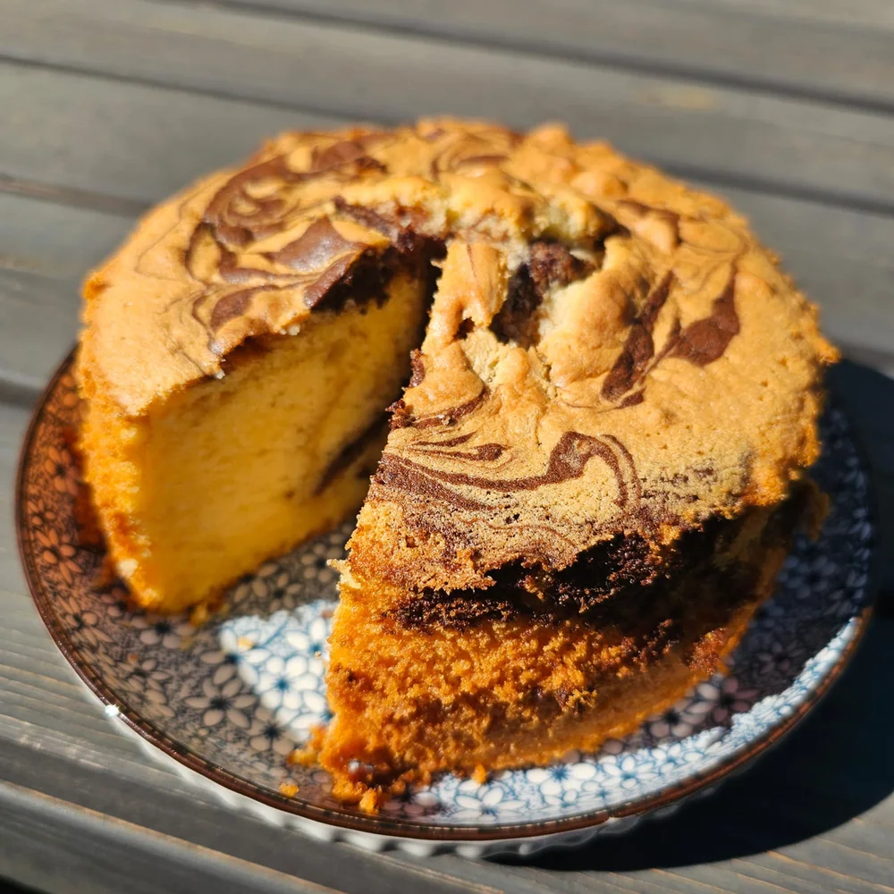 Traditional marble butter cake showing its vanilla and chocolate swirl by Amour Desserts